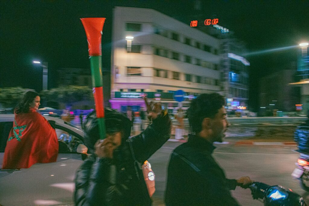 People celebrating on motorcycles at night