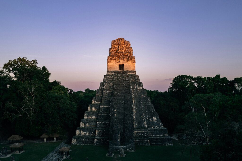 Ancient mayan pyramid temple at sunrise in tikal