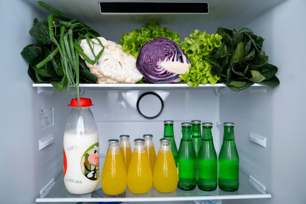 A refrigerator filled with lots of food and drinks