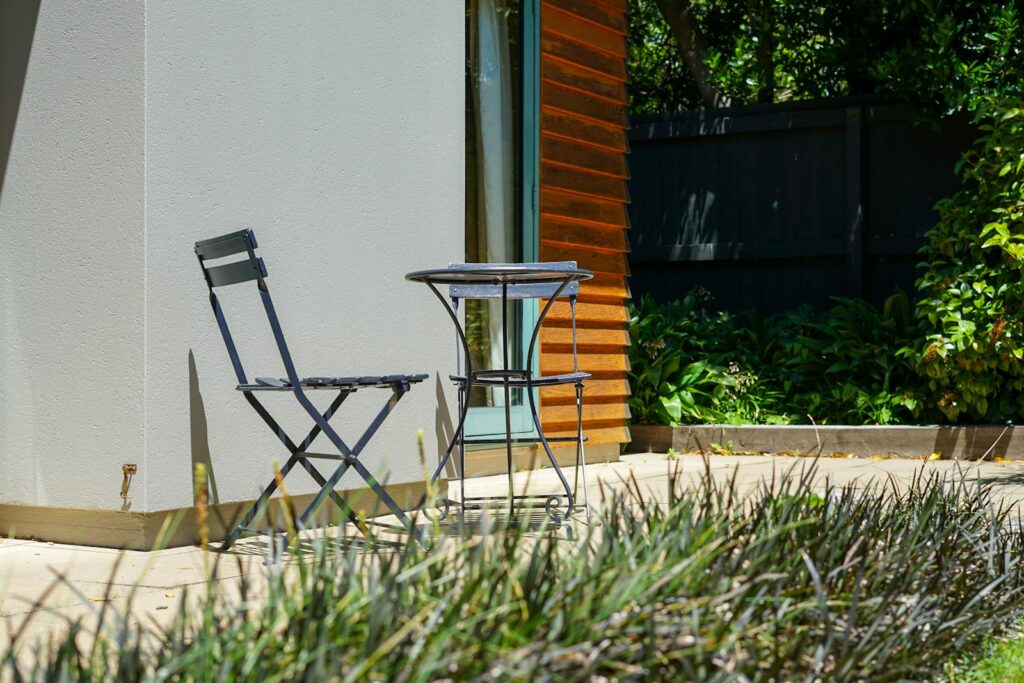 a couple of chairs sitting next to a table
