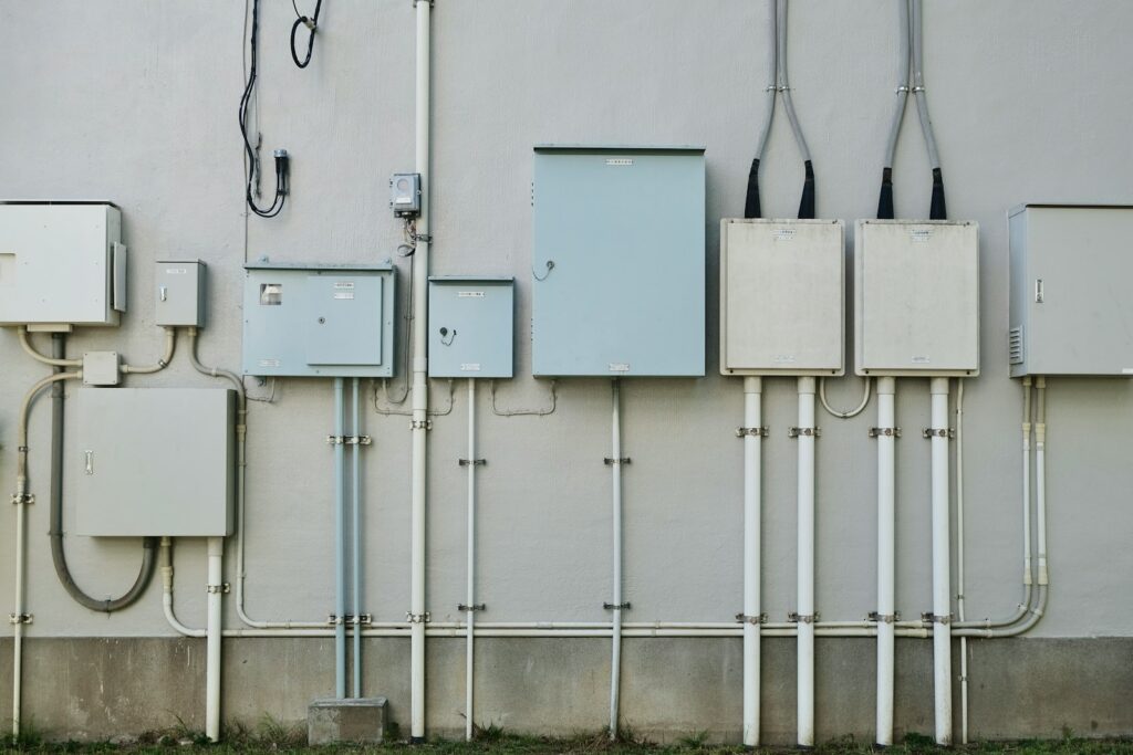 a bunch of electrical wires are attached to a wall