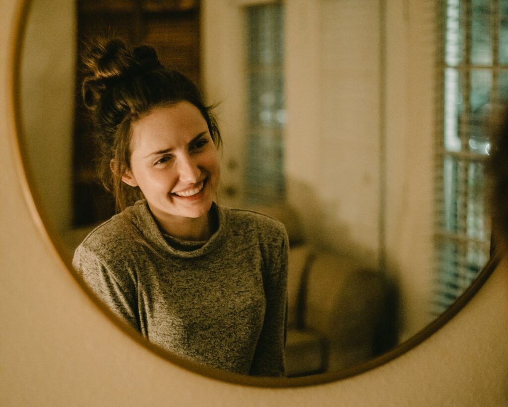 woman in gray crew neck shirt practicing self acceptance