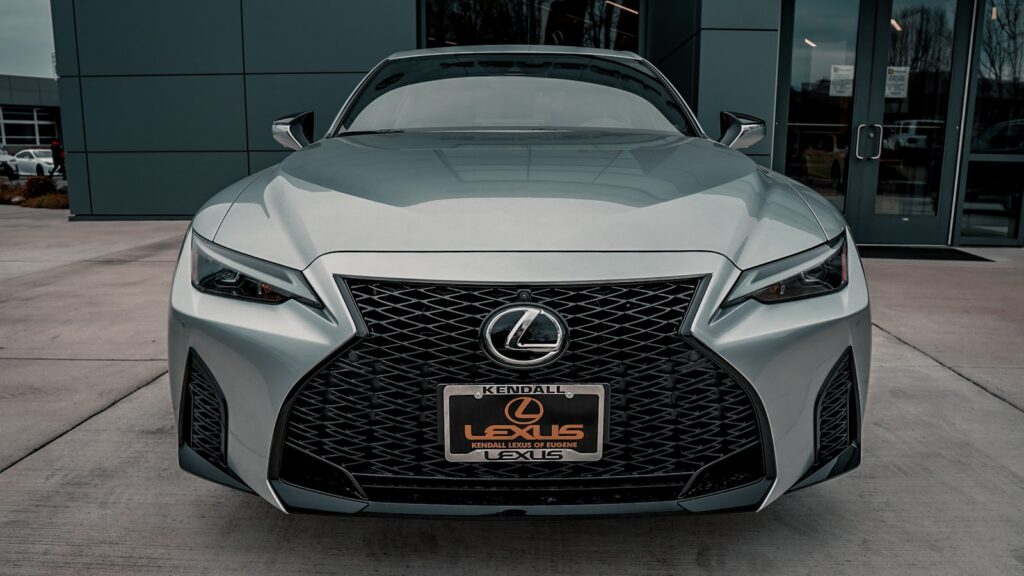 a silver Lexus LS car parked outside a building
