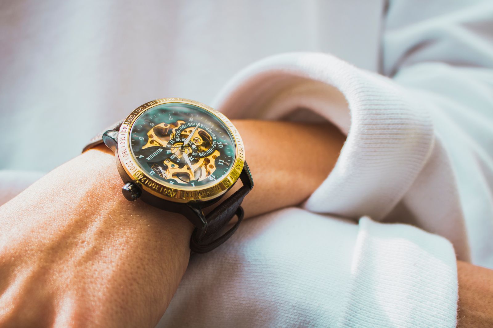A detailed view of a mechanical wristwatch showcasing intricate gears and design.