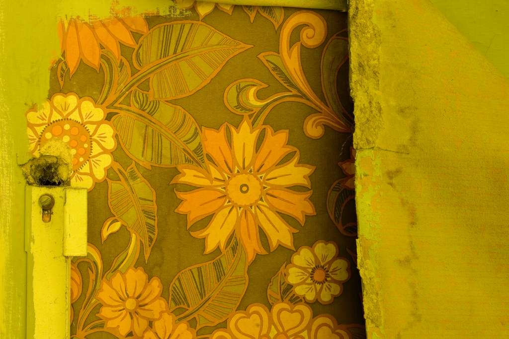 Dirty and peeling vintage wallpaper