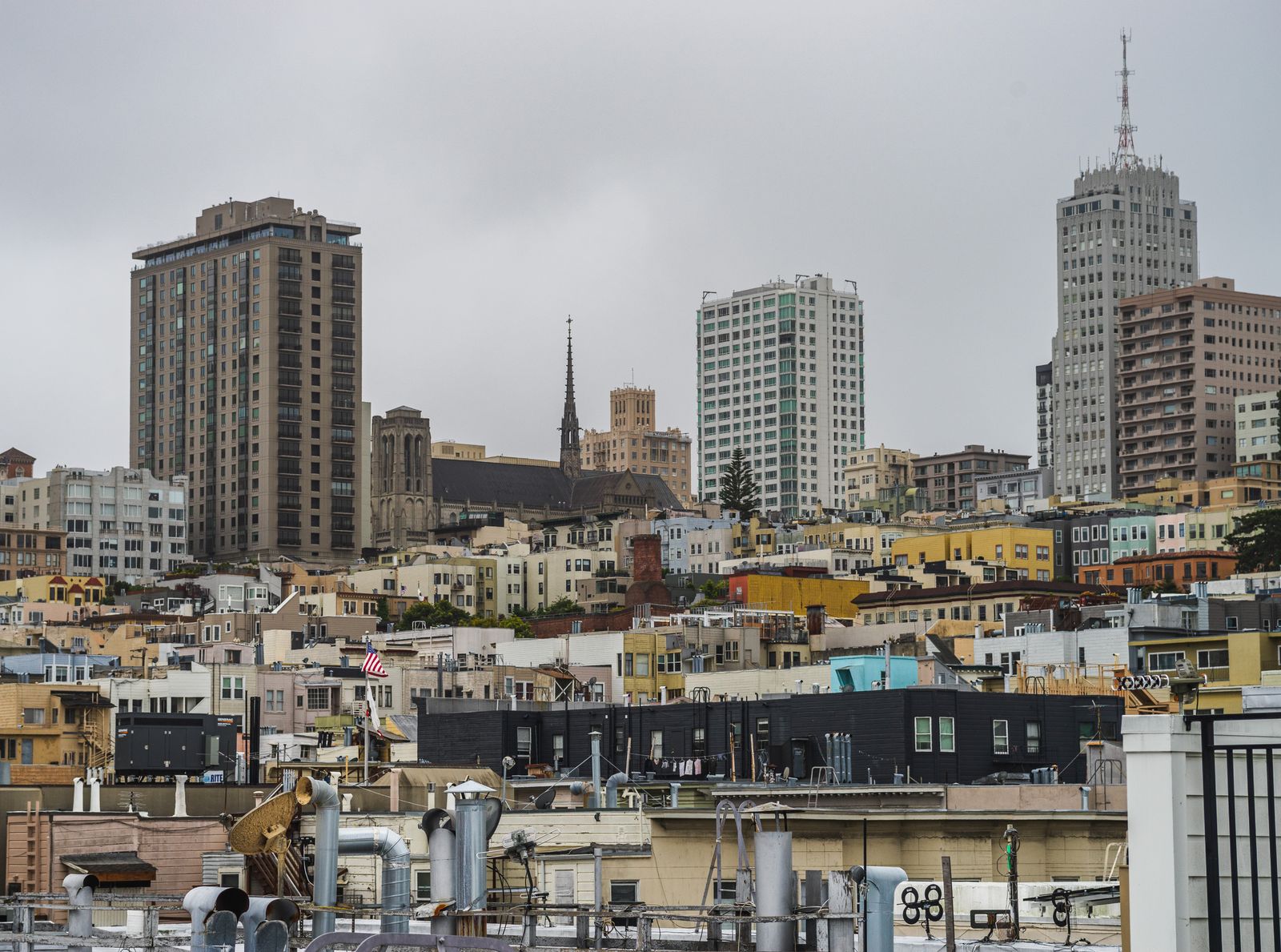 Dramatic view of San Francisco skyline featuring tall buildings and urban architecture.