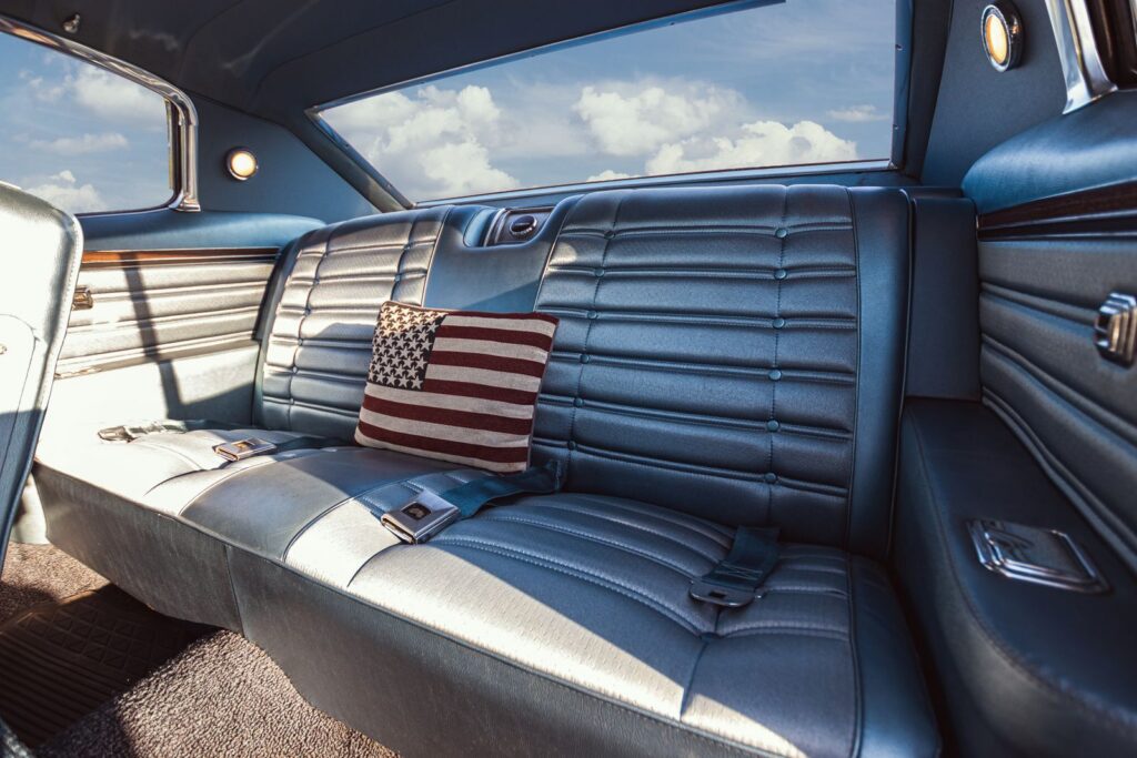Explore the classic interior design of a 1966 Chevrolet Caprice, featuring blue seats and nostalgic elements.