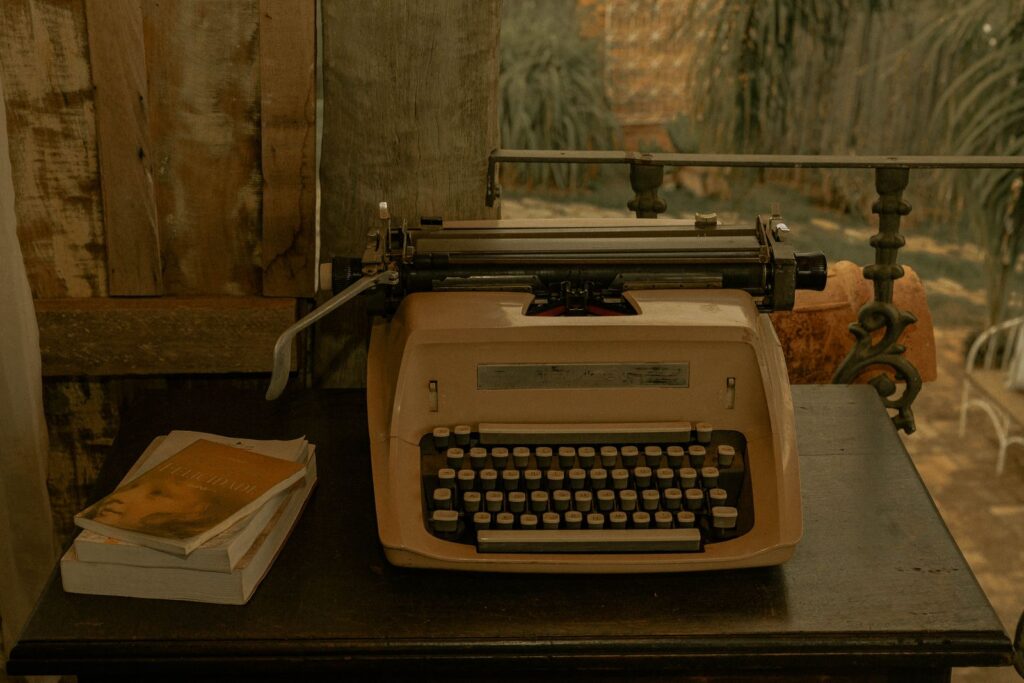 A classic typewriter on a wooden desk, evoking a nostalgic and literary ambiance.