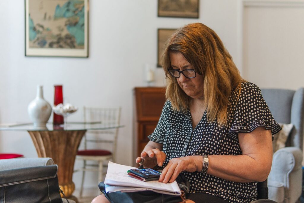 Senior woman calculating Social Security benefits