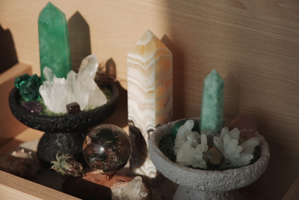 Aesthetic arrangement of crystals and minerals in soft indoor light, showcasing natural beauty.