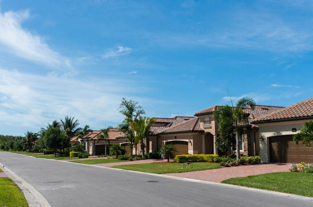 white and brown painted house in residential neighborhood