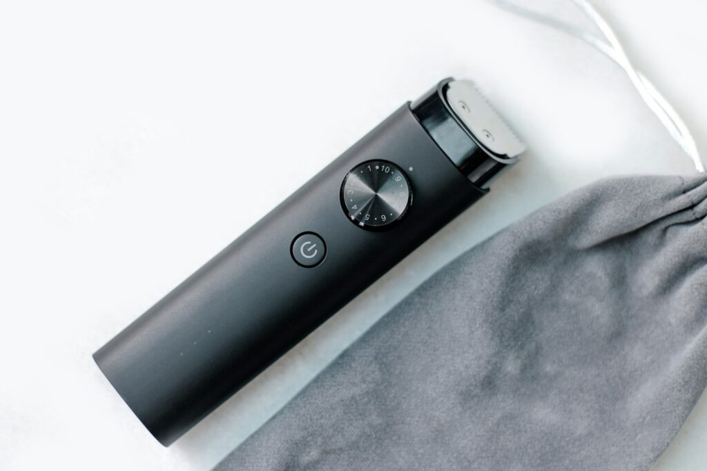 an electronic device sitting on top of a gray bag