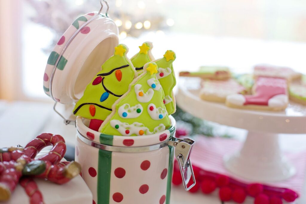 Delightful Christmas tree cookies in a polka dot jar, perfect for the festive season.