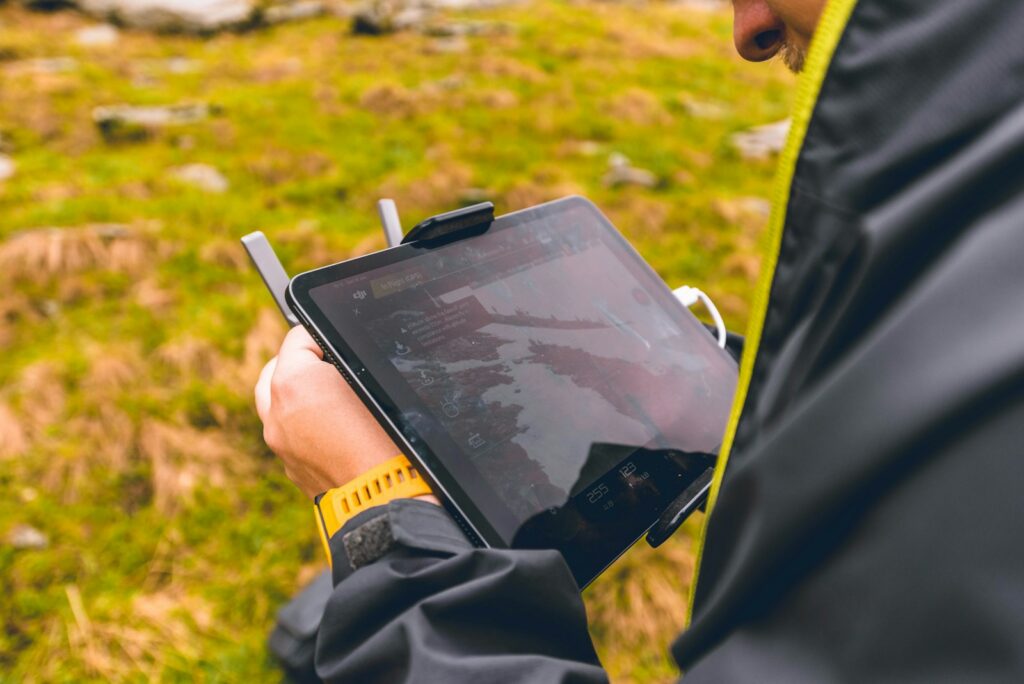 person holding black tablet computer
