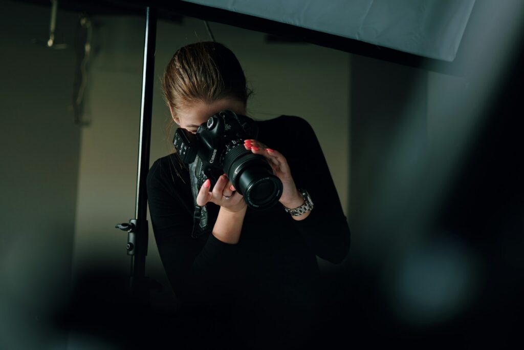 Woman with camera learning photography