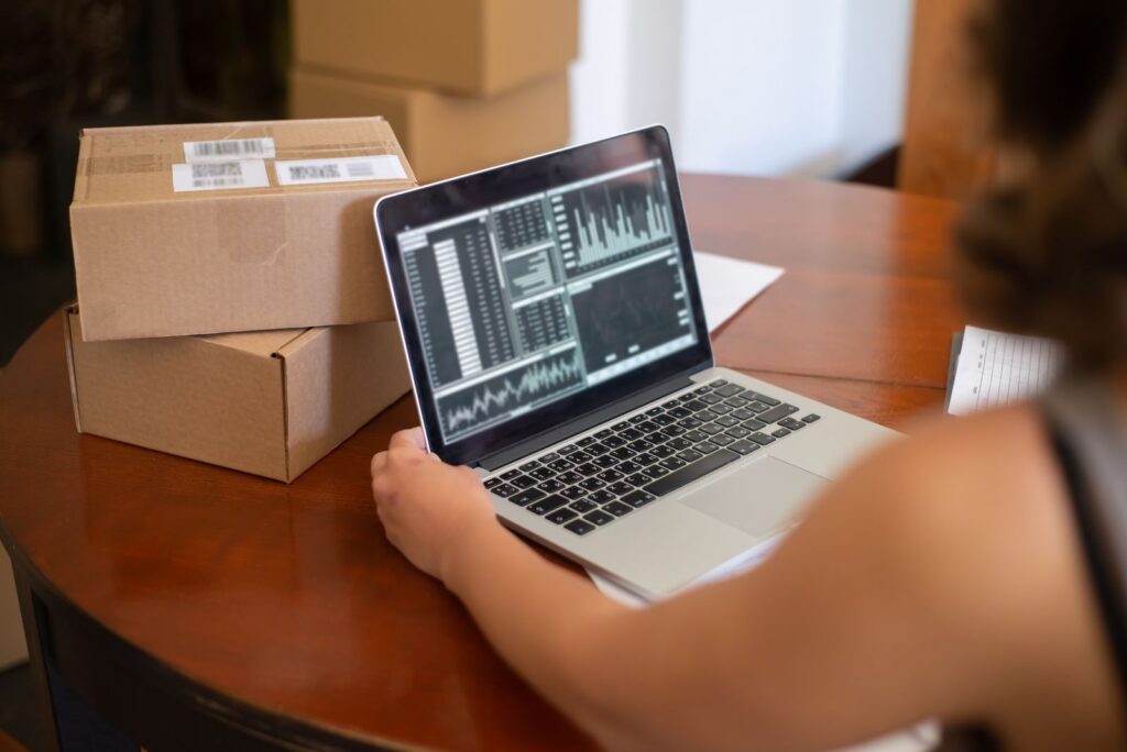 Small business owner managing online orders from a laptop 