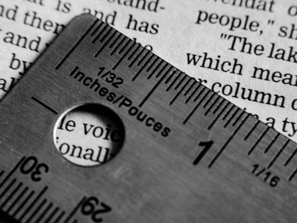 A ruler measuring text on a page.