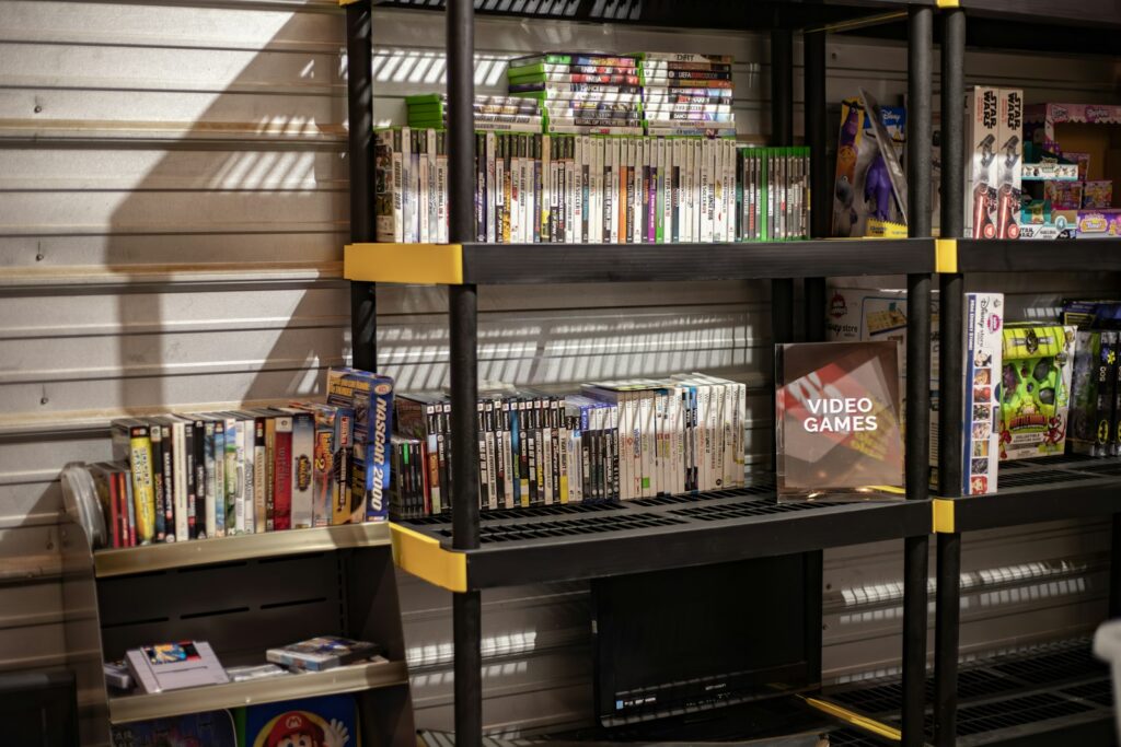 a bunch of video games are on a shelf