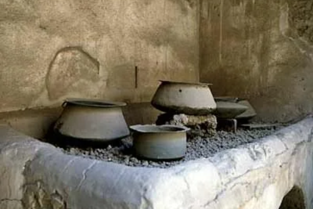 Roman kitchen with bronze cooking pots
