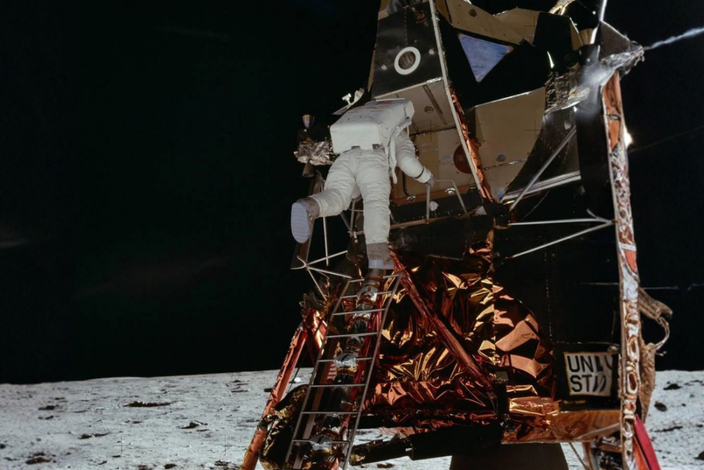 Astronaut descending the ladder on the moon