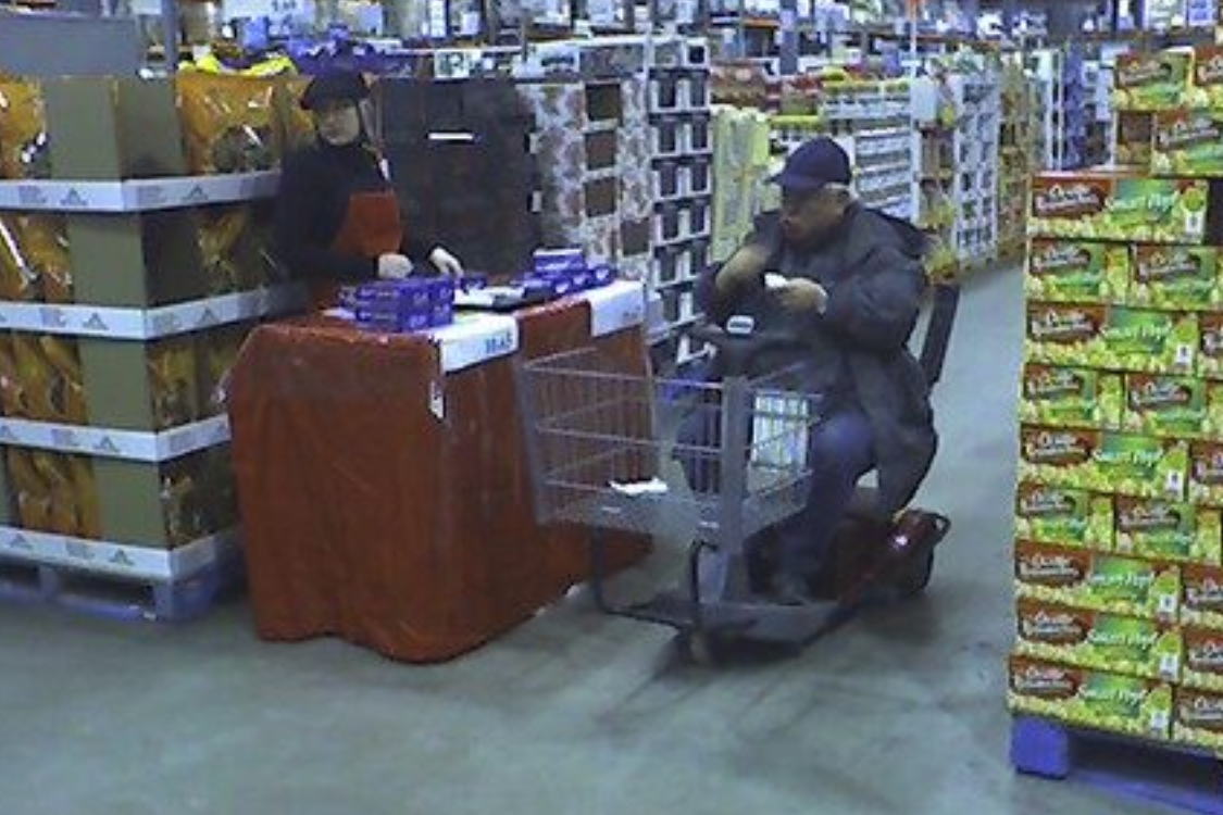 Shopper enjoying free food sample at Costco