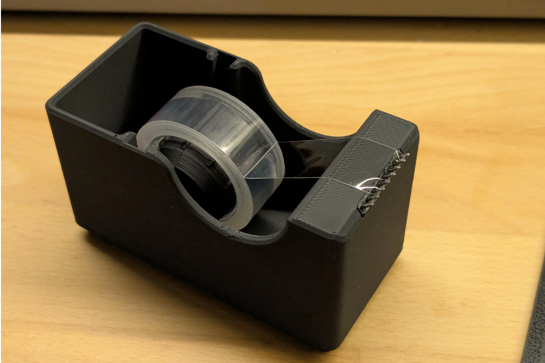 Desktop tape dispenser with pin header blade