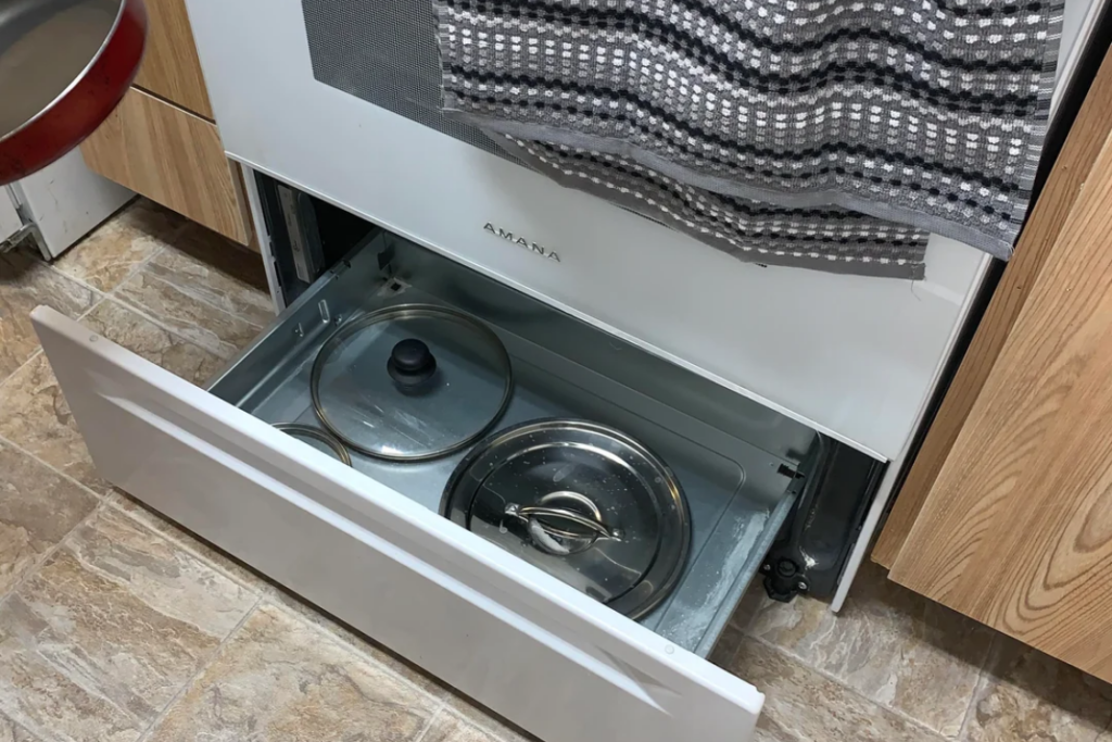 Drawer beneath oven for warming food or storage
