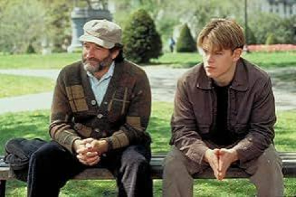Sean and Will laughing together on the park bench