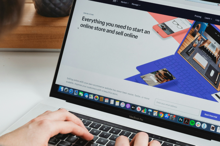 Person using macbook to set up an online store to sell products