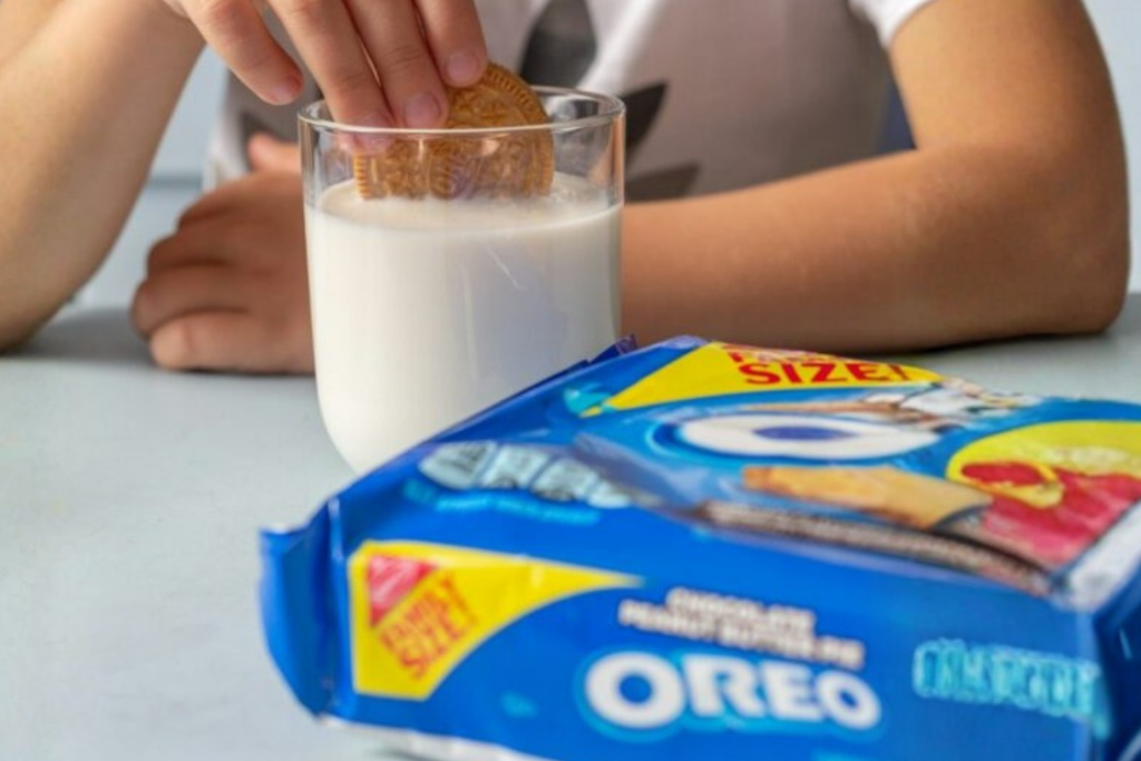 Kid enjoying oreos and milk for snack