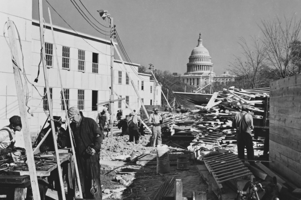 Construction workers building near the capitol building.