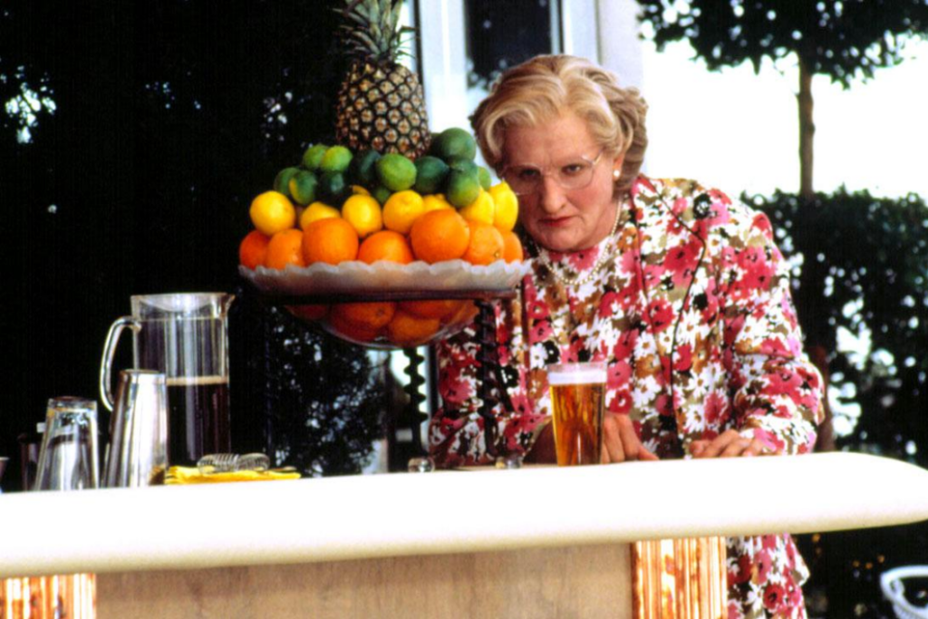 Robin Williams as Mrs. Doubtfire preparing to throw the lime