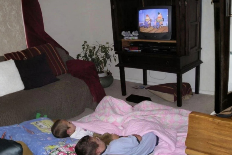 Saturday morning cartoons scene with kids and blankets in living room