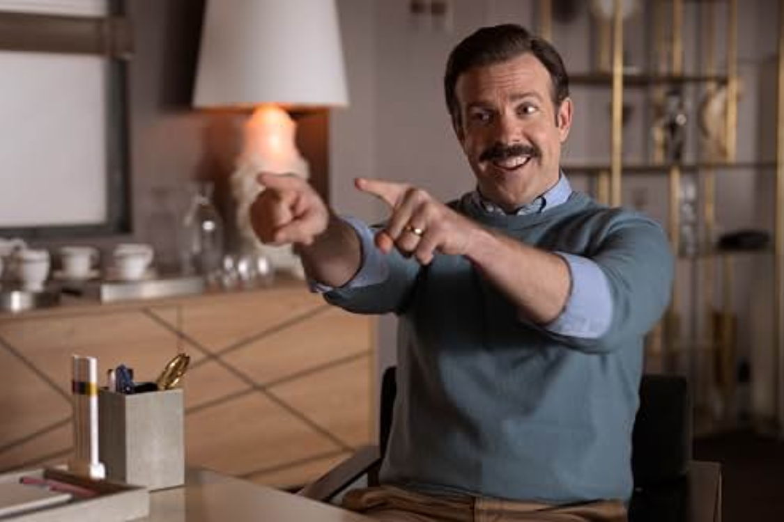 Ted Lasso smiling or laughing