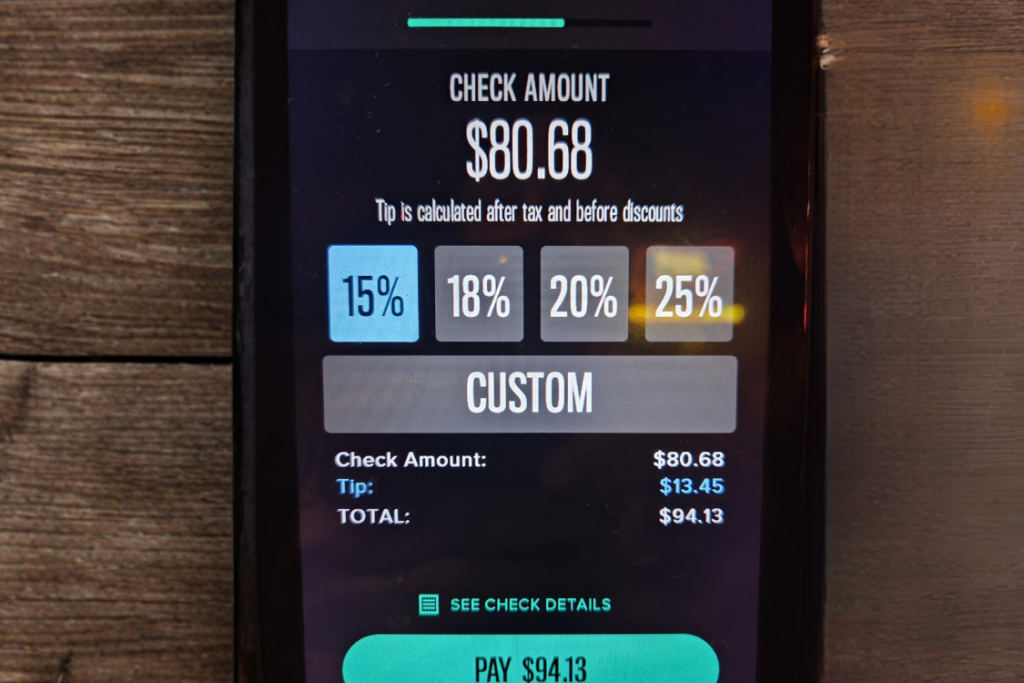 Payment terminal with add tip window before checkout