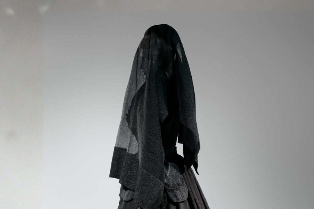 Widow mourning in black with veil