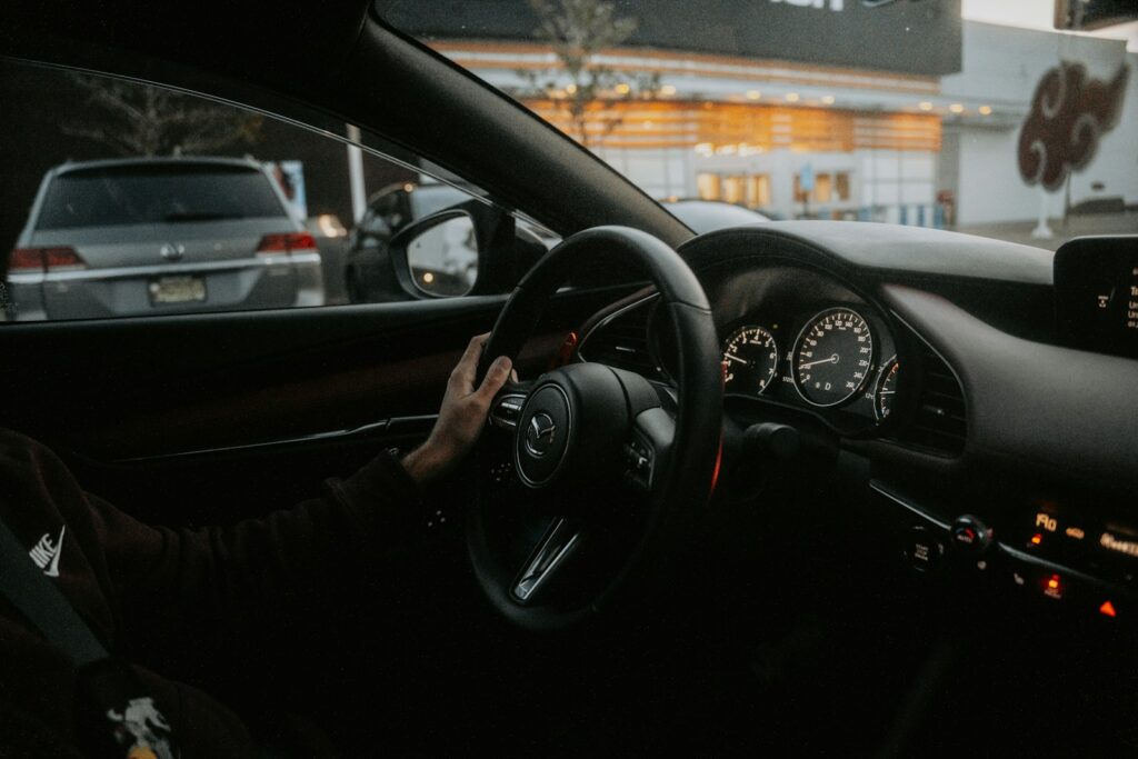 A person driving a car on a city street