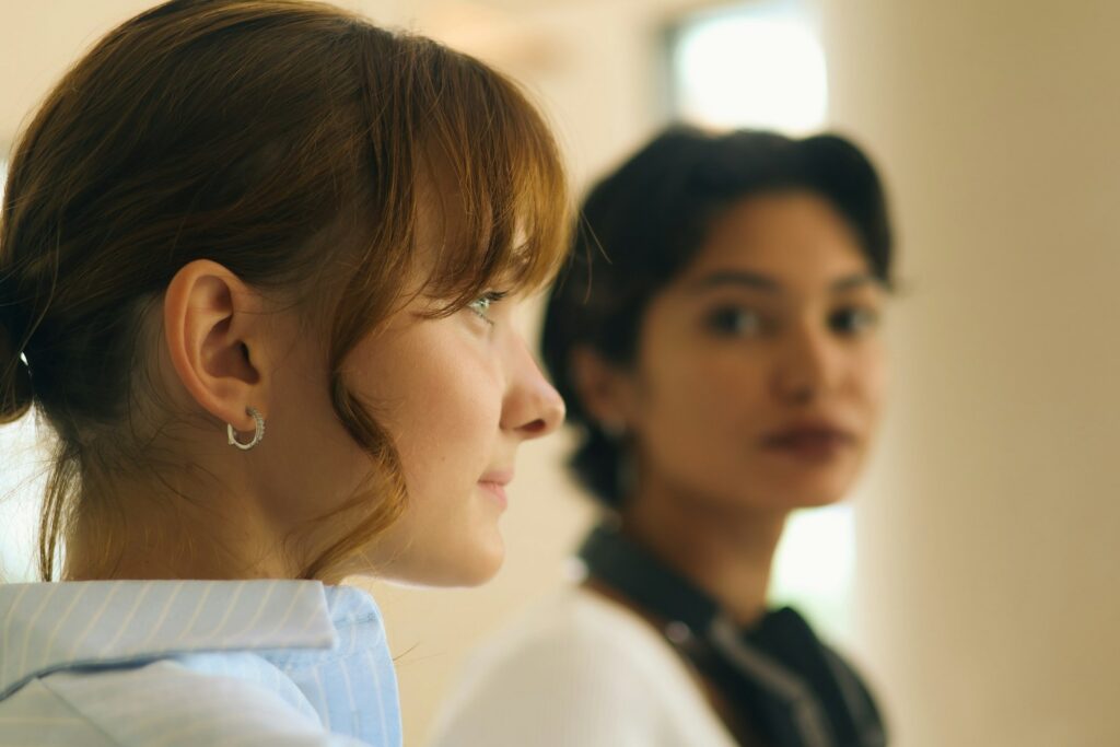 Two women looking in different directions