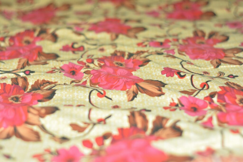 Close-up of a floral pattern with pink flowers.