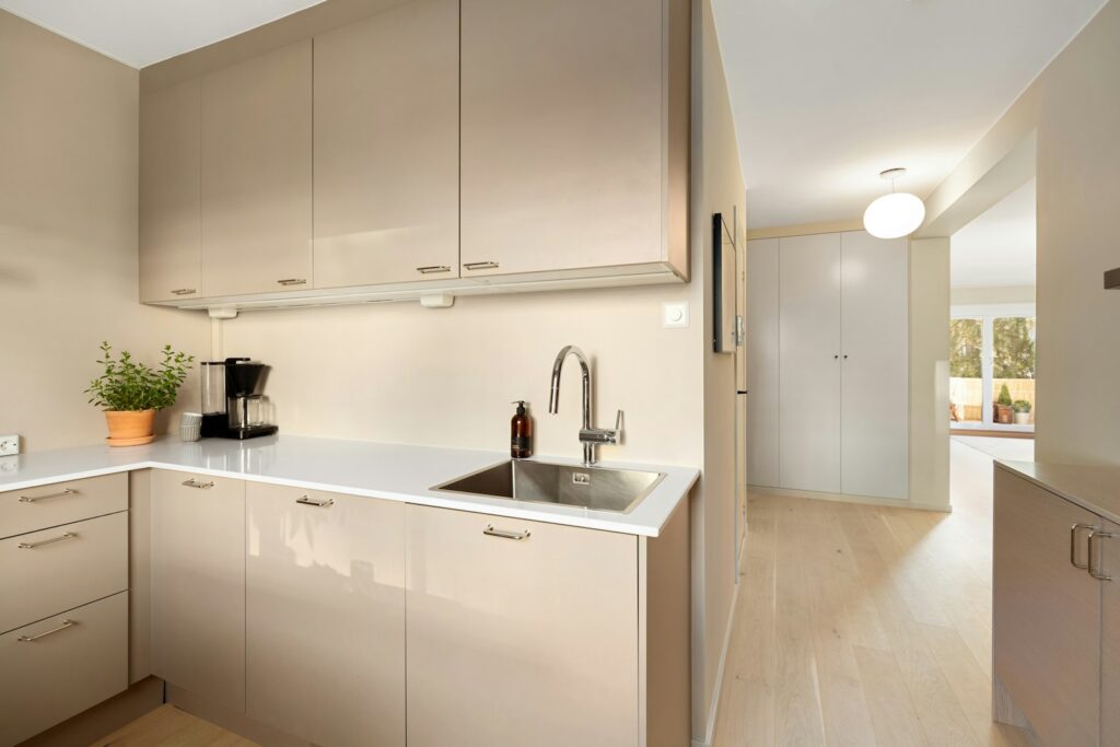 A kitchen with a sink and a window
