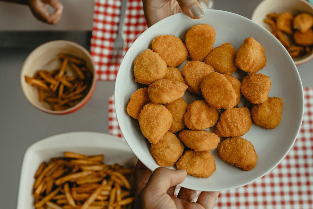 chicken nuggets on white ceramic bowl