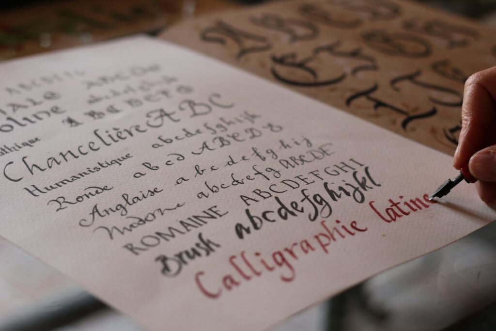 Person practicing calligraphy with pen