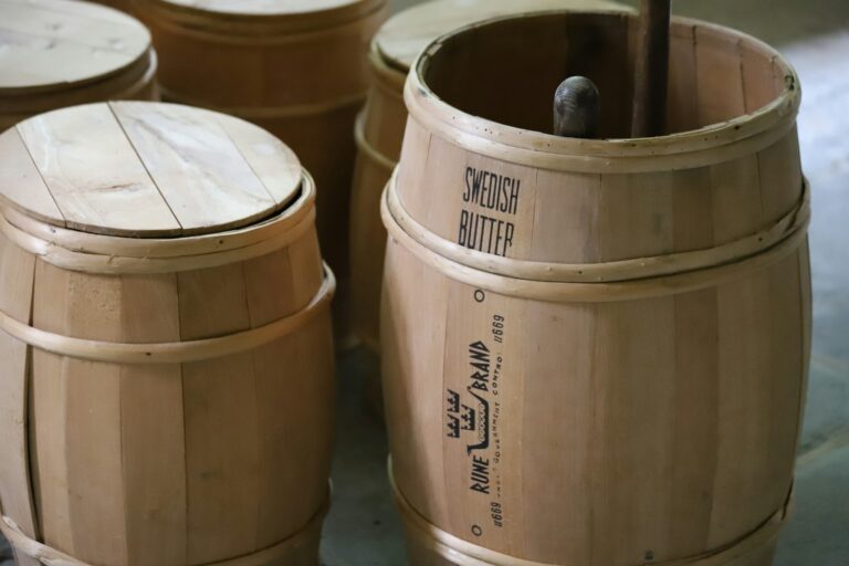A group of wooden barrels sitting next to each other