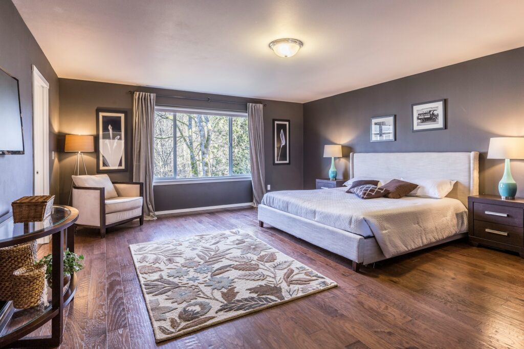 Elegant bedroom with rug on the floor