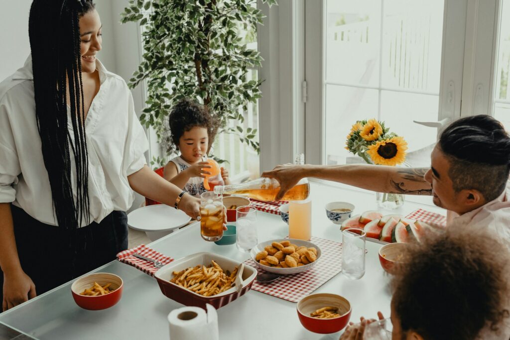 Family with small kids eating together