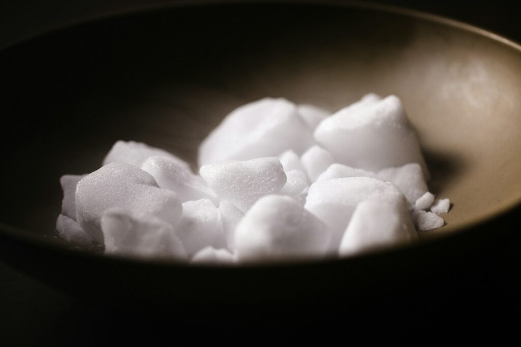 paraffin wax in black bowl