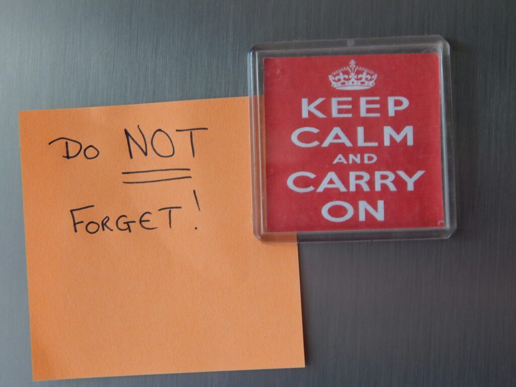 a refrigerator door with a magnet and a note attached to it
