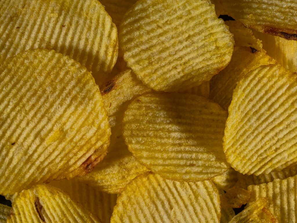 Detailed texture of crunchy ridged potato chips