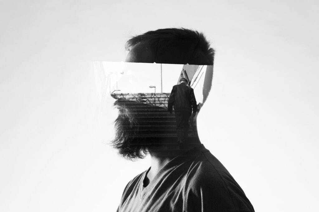 man walking up the stairs projection on man's head illustration