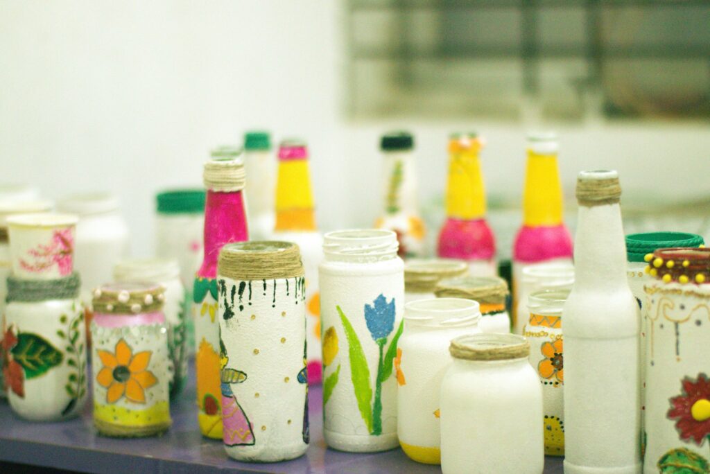 Colorful decorated jars and bottles on a shelf